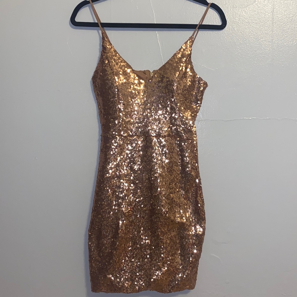 A rose gold sequin-covered mini- cocktail dress in a size medium:))